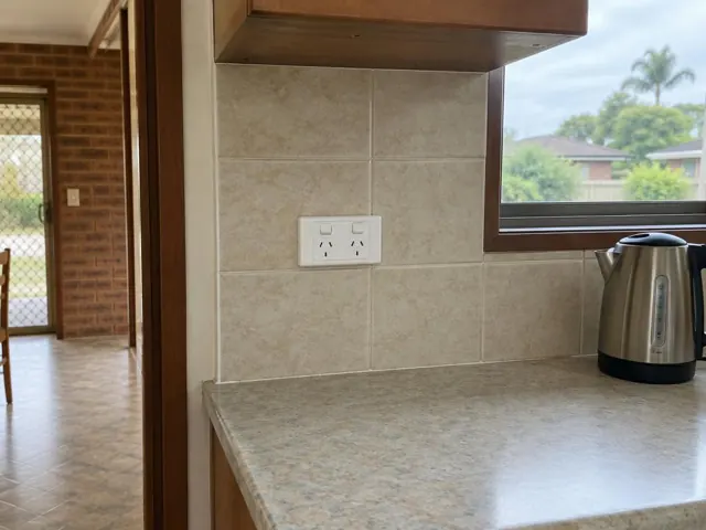 New double power point on tiled kitchen wall above benchtop in Buff Point